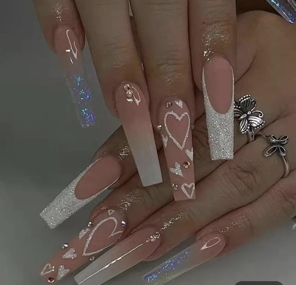 Long Coffin Press on Nails. Clear White Tips with Glitter & Hearts. Durable Acrylic Press on Nails. Easy and quick to apply. Great for those special occasions, parties or add an edge to any outfit. Gorgeous, flattering and you can re-use them again and again.