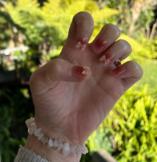 Squoval Press on Nails. Pink with Bows. Durable Acrylic Press on Nails. Easy and quick to apply. Re-use them again and again.