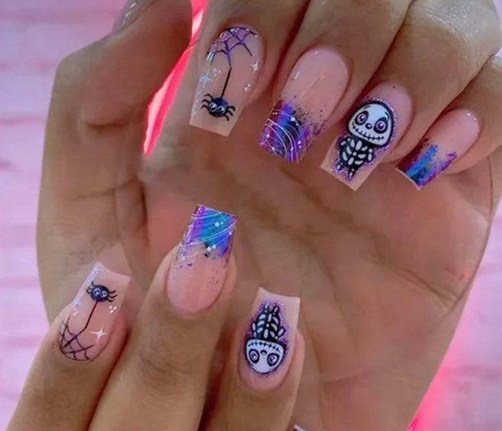 Spooky Halloween Press on Nails.Medium Length Coffin Nails. Pin with Blue, Purple & White Tips with Spiders and Spider Webs and Skeletons.