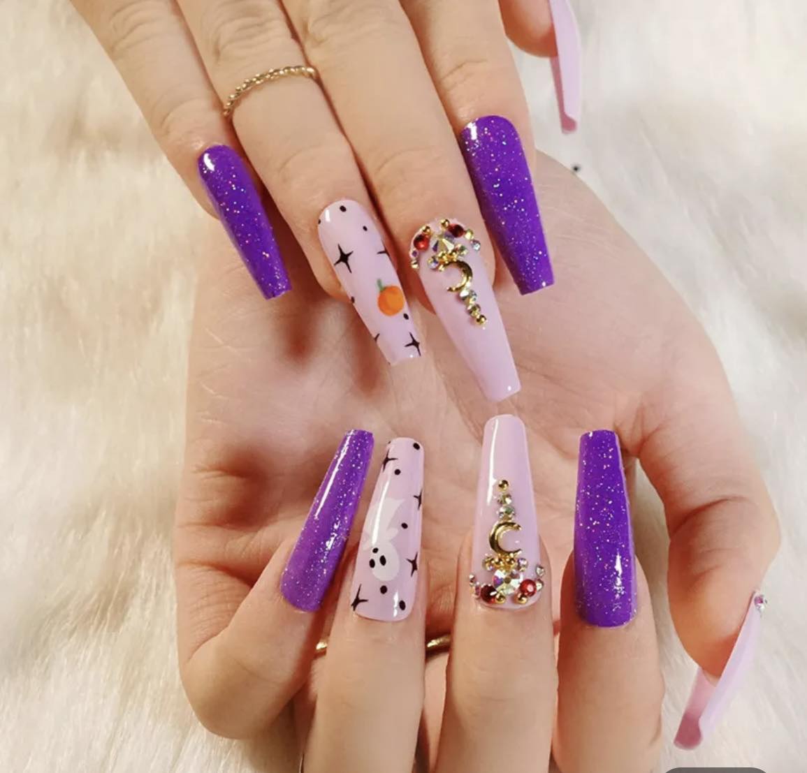 Halloween Long Coffin Press on Nails. Purple & Pink with Ghosts & Pumpkins. Easy and quick to apply. Great for those special occasions, parties or add an edge to any outfit. Gorgeous, flattering and you can re-use them again and again.
