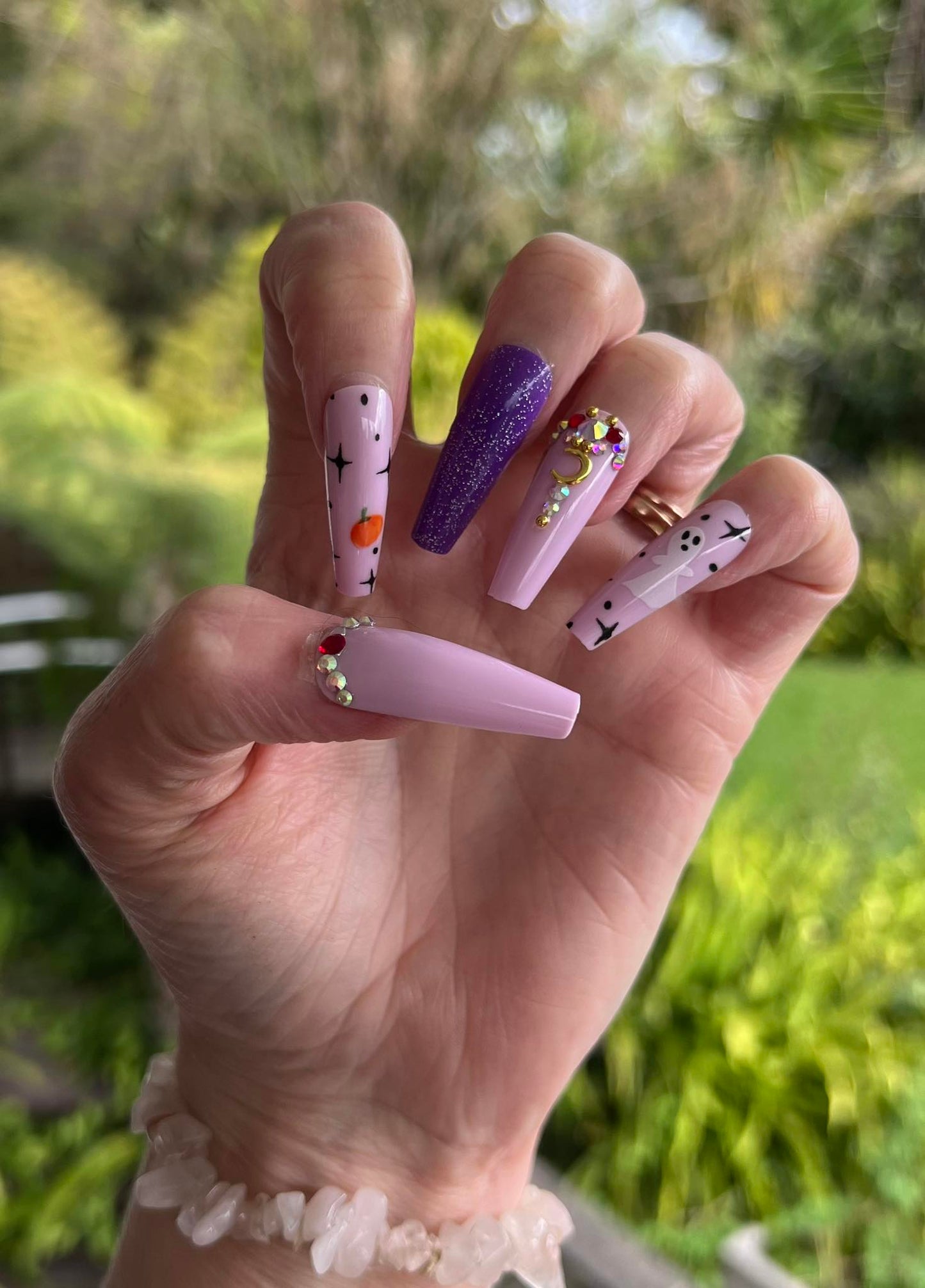Halloween Long Coffin Press on Nails. Purple & Pink with Ghosts & Pumpkins. Easy and quick to apply. Great for those special occasions, parties or add an edge to any outfit. Gorgeous, flattering and you can re-use them again and again.