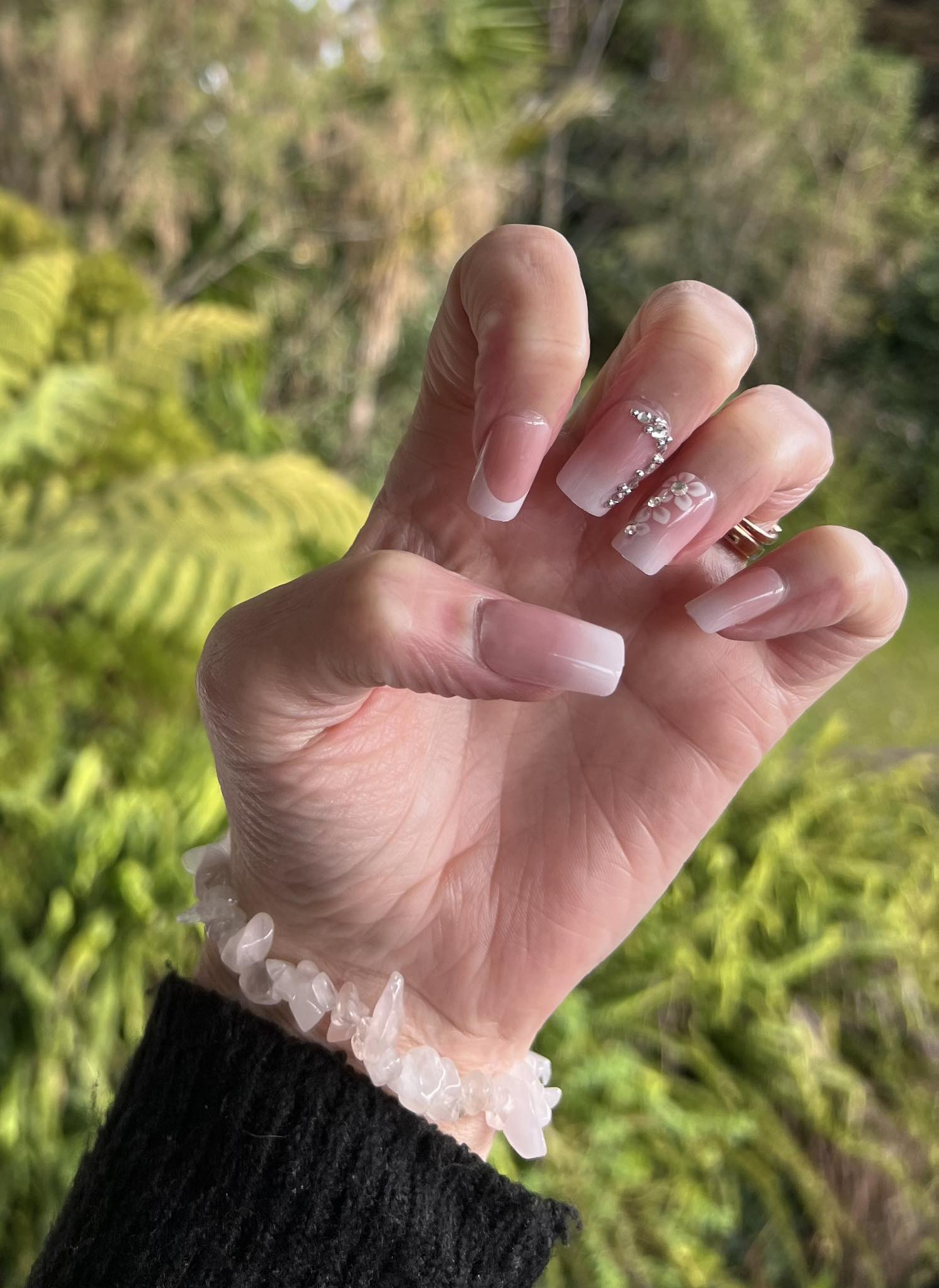 Square Press on Nails. White Tip, Jewel & Flowers. Durable Acrylic Press on Nails. These French Tip Nails are stunning and sell out fast. Easy and quick to apply. Great for any occasion. Gorgeous, flattering and you can re-use them again and again.