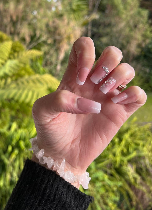 Square Press on Nails. White Tip, Jewel & Flowers. Durable Acrylic Press on Nails. These French Tip Nails are stunning and sell out fast. Easy and quick to apply. Great for any occasion. Gorgeous, flattering and you can re-use them again and again.