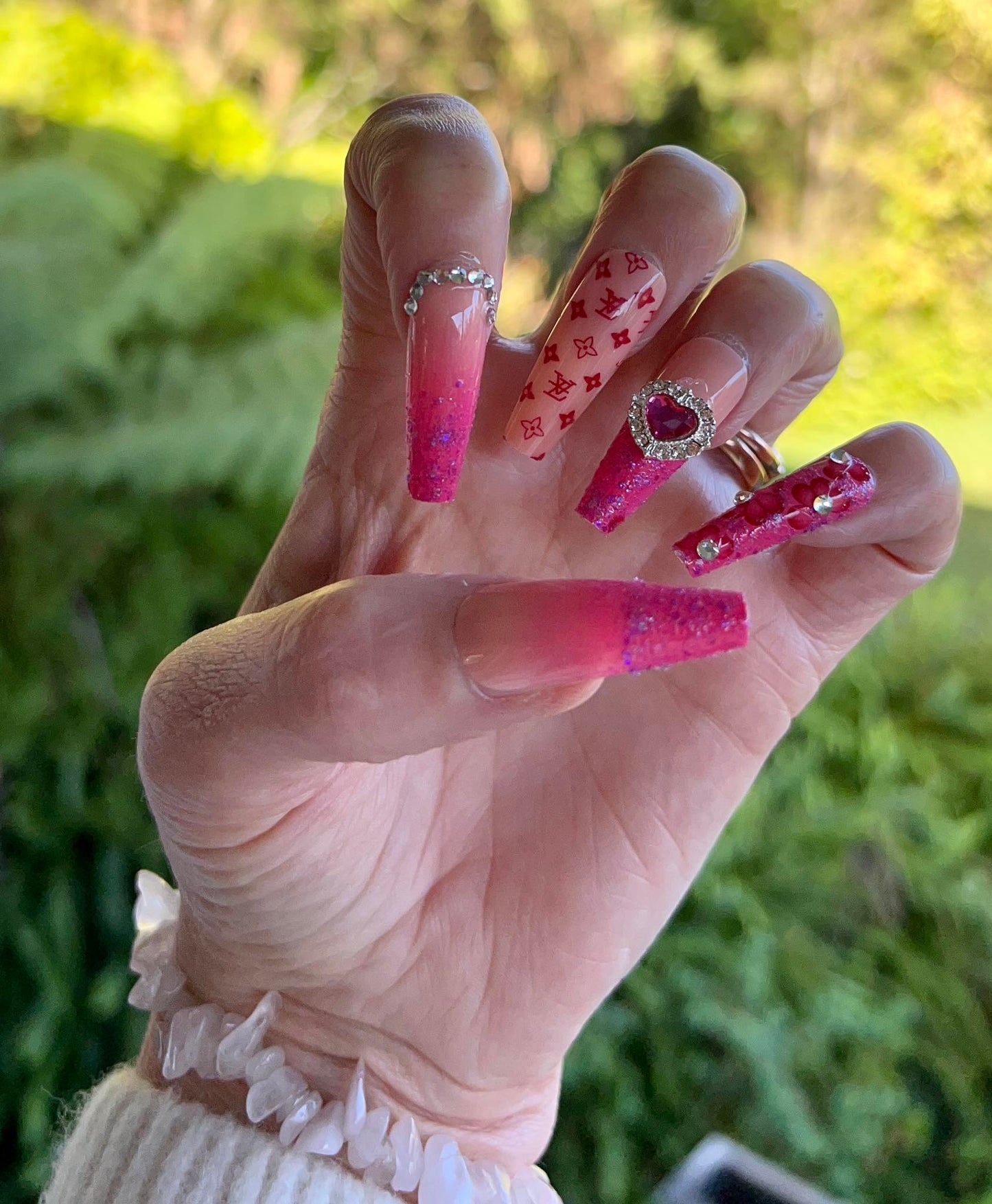 Long Coffin Press on Nails Red, Pink & Purple with Jewels & Hearts. Easy and quick to apply. Great for those special occasions, parties or add an edge to any outfit. Gorgeous, flattering and you can re-use them again and again.