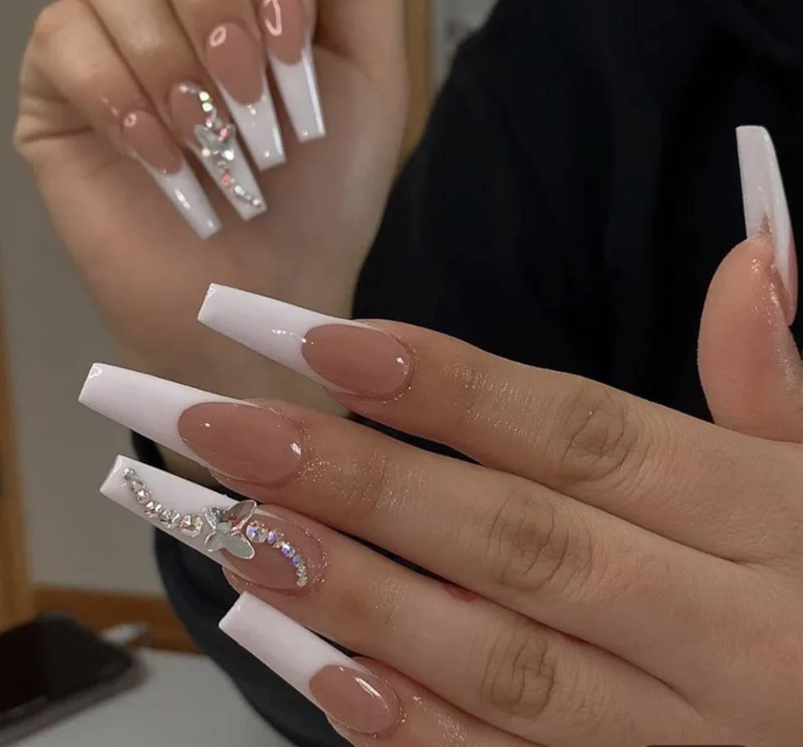 Long Coffin French Tip Press on Nails. White Tips with Jewel & Butterfly. Easy and quick to apply. Great for those special occasions, parties or add an edge to any outfit. Gorgeous, flattering and you can re-use them again and again.