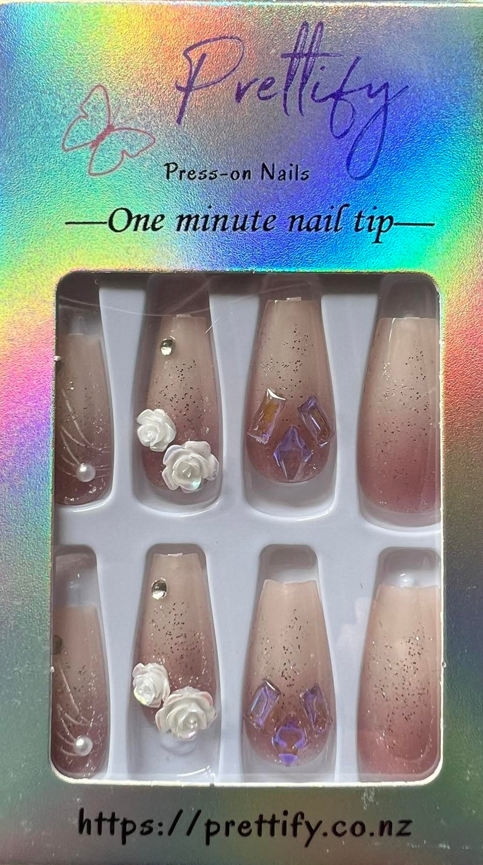 Medium Length Coffin Press on Nails. Cream/Taupe Ombre with Lilac Jewels & Glitter and White 3D Roses. Durable Acrylic Press on Nails. Easy and quick to apply. Great for those special occasions, parties or add an edge to any outfit. Gorgeous, flattering and you can re-use them again and again.