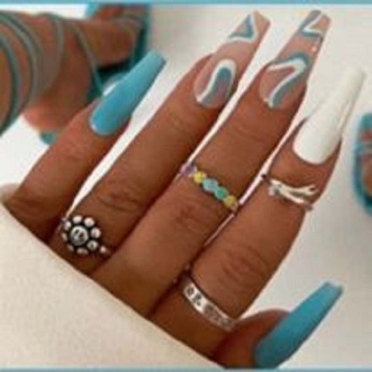 Long Coffin Press on Nails. Blue & White with Swirls. Durable Acrylic Press on Nails. Easy and quick to apply. Great for those special occasions, parties or add an edge to any outfit. Gorgeous, flattering and you can re-use them again and again.