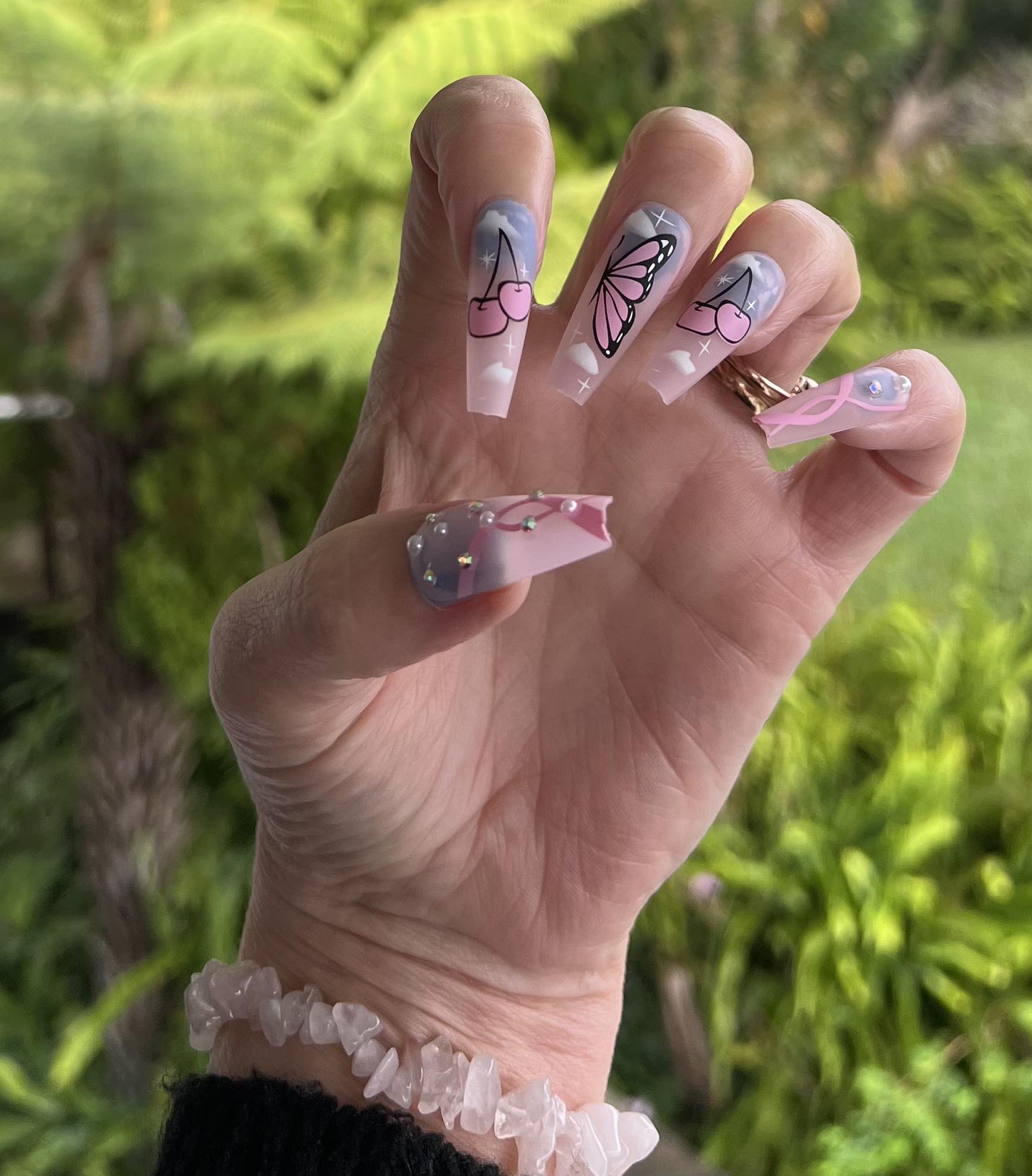 Long Coffin Press on Nails. Clear Pink with Butterflies & Cherries. Durable Acrylic Press on Nails. Easy and quick to apply. Great for those special occasions, parties or add an edge to any outfit. Gorgeous, flattering and you can re-use them again and again.