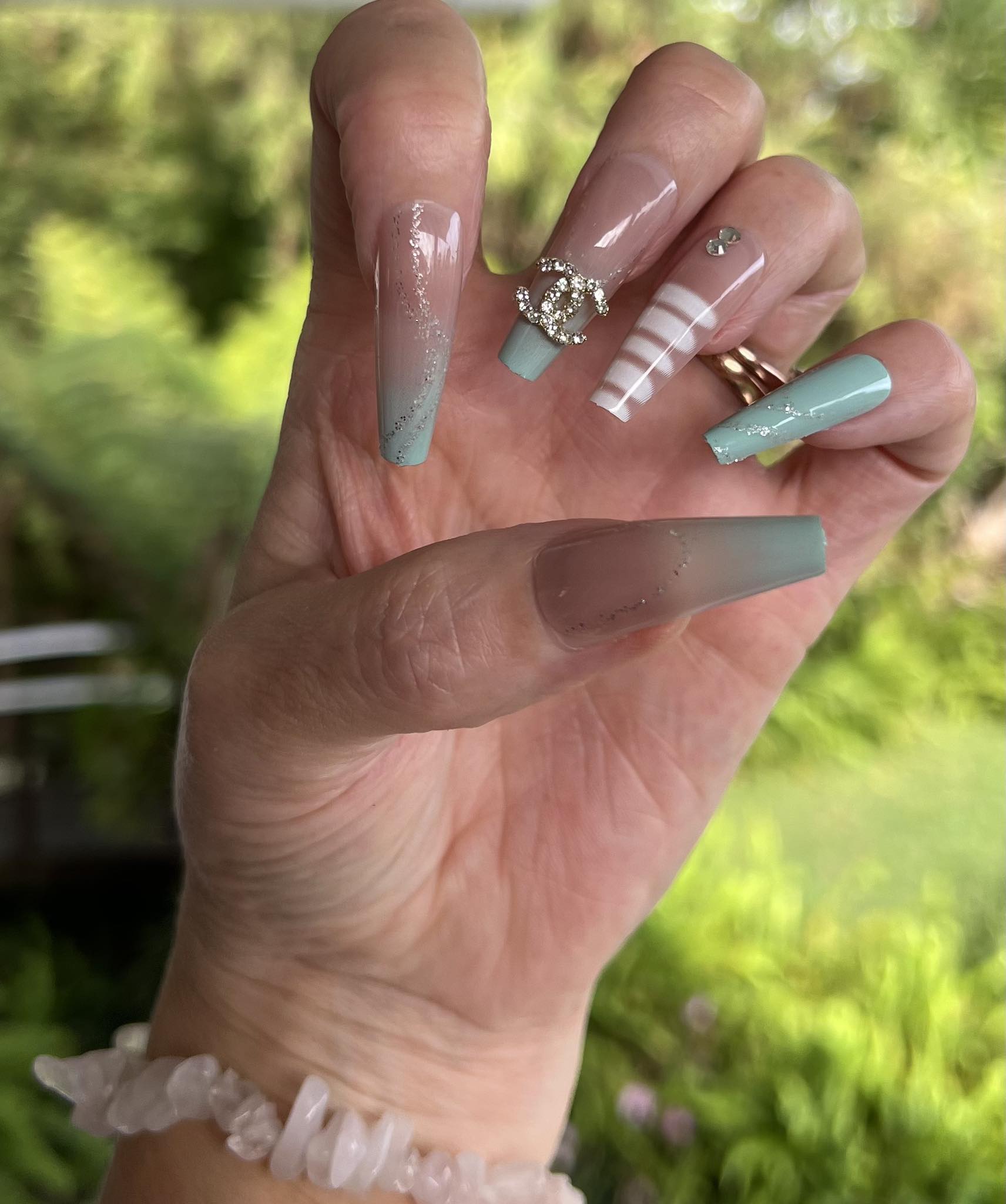 Long Coffin Press on Nails. Aqua, White & Silver with Jewels. Durable Acrylic Press on Nails. Easy and quick to apply. Great for those special occasions, parties or add an edge to any outfit. Gorgeous, flattering and you can re-use them again and again.