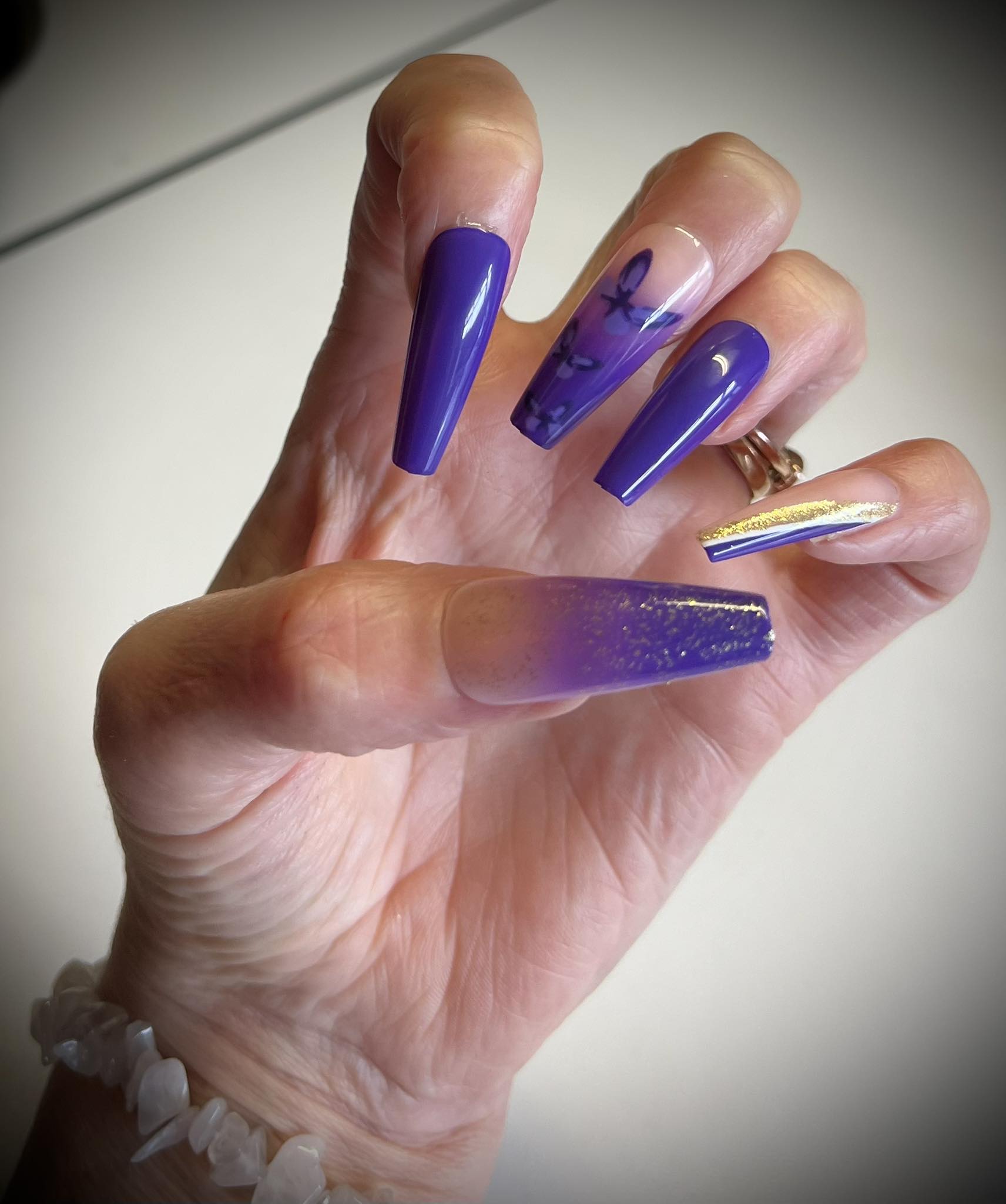 Long Coffin Press on Nails. Purple with Butterflies & Glitter. Easy and quick to apply. Great for those special occasions, parties or add an edge to any outfit. Gorgeous, flattering and you can re-use them again and again.