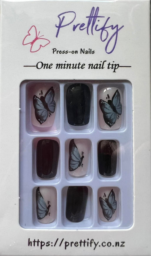Medium Length Squoval Press on Nails. Black with Butterflies. Durable Acrylic Press on Nails. Easy and quick to apply. Great for those special occasions, parties or add an edge to any outfit. Gorgeous, flattering and you can re-use them again and again.
