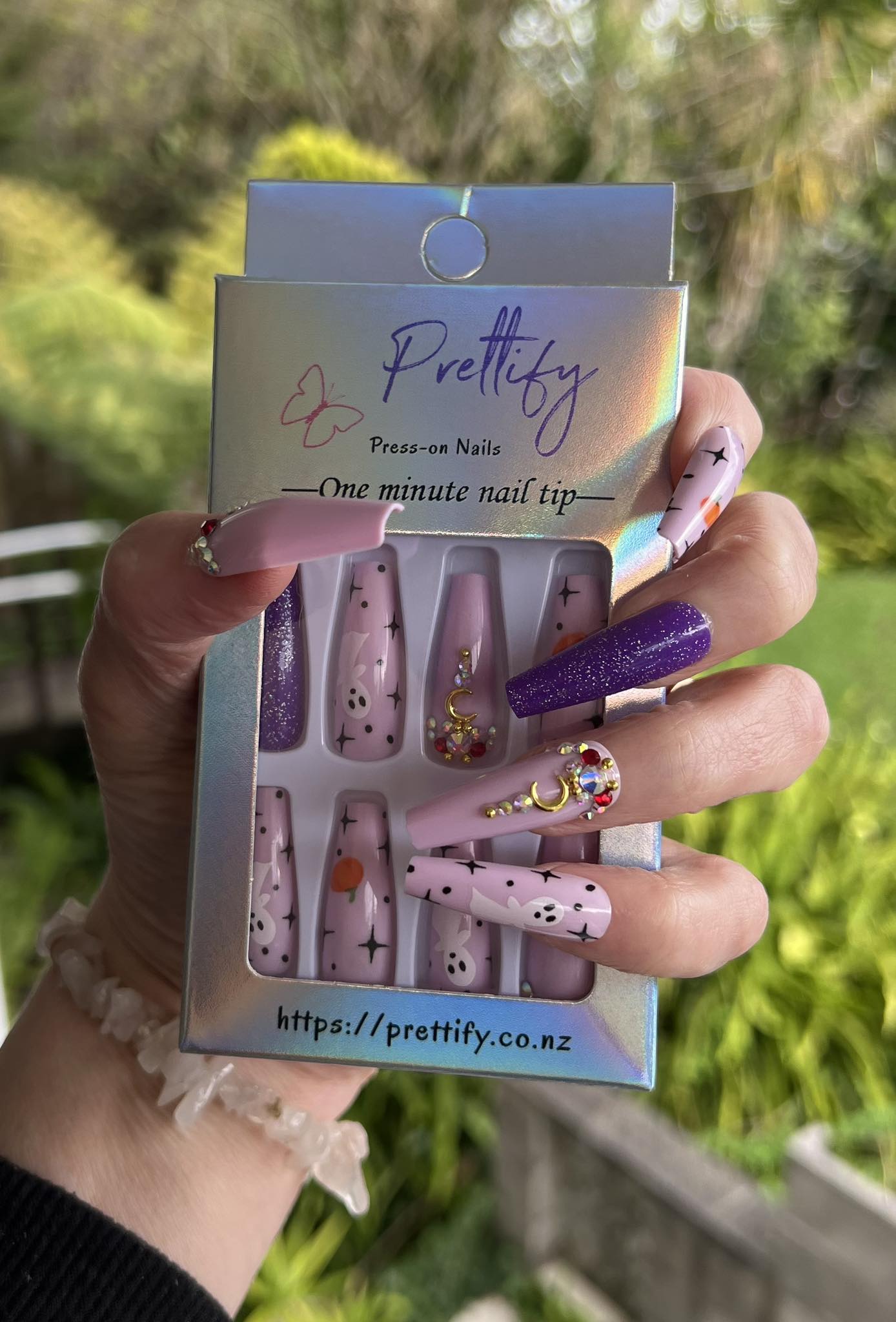 Halloween Long Coffin Press on Nails. Purple & Pink with Ghosts & Pumpkins. Easy and quick to apply. Great for those special occasions, parties or add an edge to any outfit. Gorgeous, flattering and you can re-use them again and again.