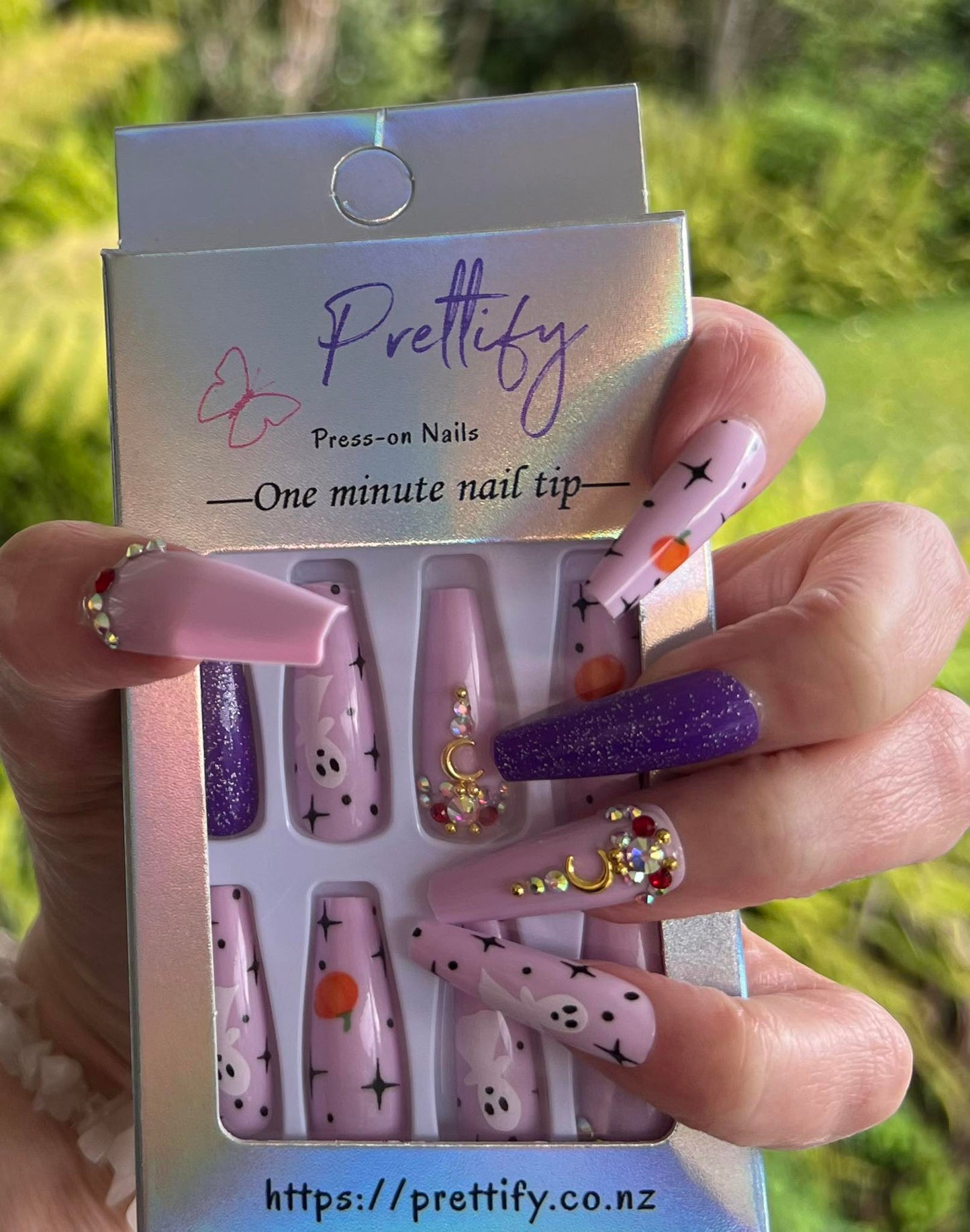 Halloween Long Coffin Press on Nails. Purple & Pink with Ghosts & Pumpkins. Easy and quick to apply. Great for those special occasions, parties or add an edge to any outfit. Gorgeous, flattering and you can re-use them again and again.