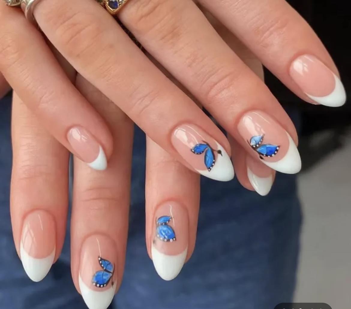 Almond Press on Nails. White tips with Blue Butterflies. Durable Acrylic Press on Nails. Easy and quick to apply. Great for those special occasions, parties or add an edge to any outfit. Gorgeous, flattering and you can re-use them again and again.