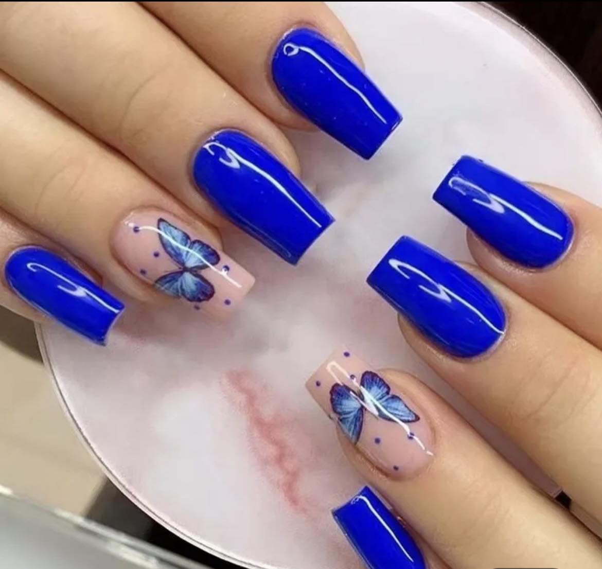 Medium Length Coffin Press on Nails. Ultra Blue with Butterflies. Easy and quick to apply. Great for those special occasions, parties or add an edge to any outfit. Gorgeous, flattering and you can re-use them again and again.