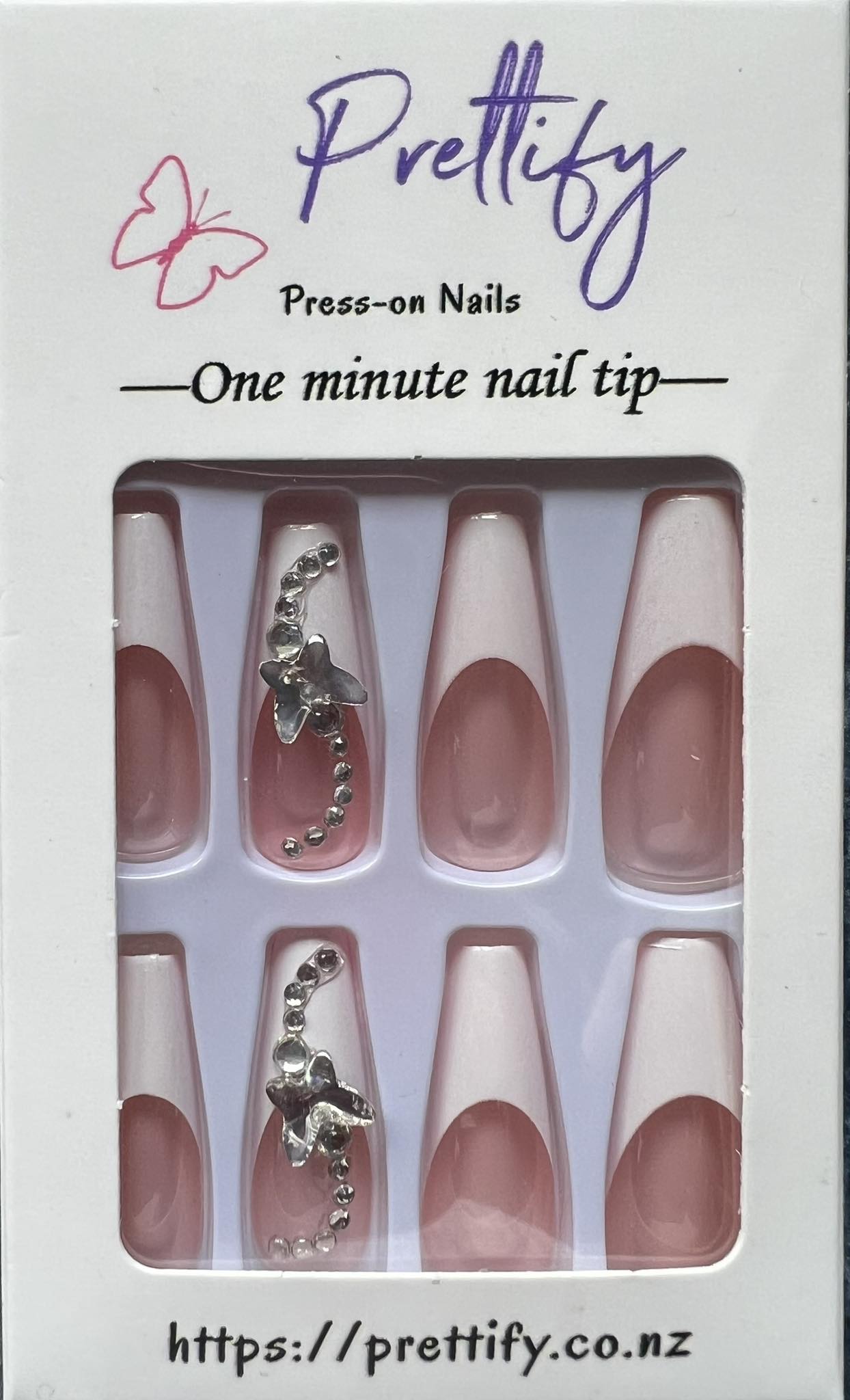 Long Coffin French Tip Press on Nails. White Tips with Jewel & Butterfly. Easy and quick to apply. Great for those special occasions, parties or add an edge to any outfit. Gorgeous, flattering and you can re-use them again and again.