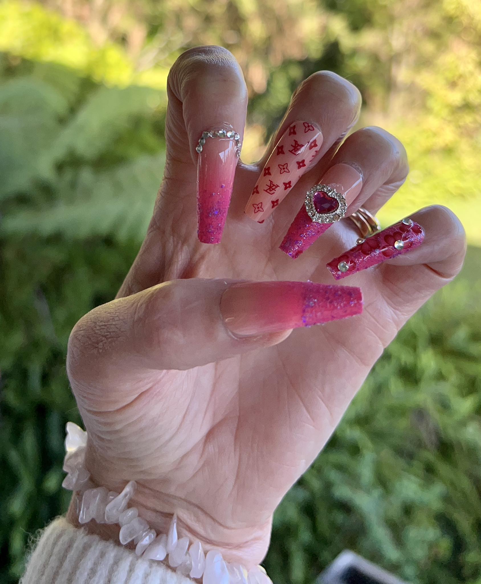 Long Coffin Press on Nails Red, Pink & Purple with Jewels & Hearts. Easy and quick to apply. Great for those special occasions, parties or add an edge to any outfit. Gorgeous, flattering and you can re-use them again and again.