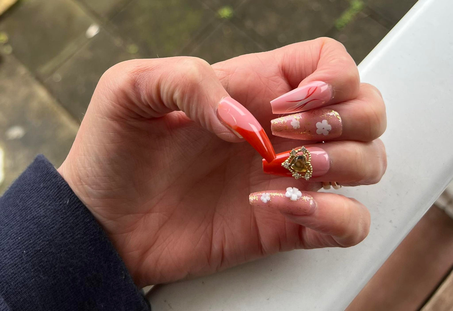 Long Coffin Press on Nails. Orange, Clear & Frosted with Glitter, Jewels, Hearts & Flowers. Easy and quick to apply. Great for those special occasions, parties or add an edge to any outfit. Gorgeous, flattering and you can re-use them again and again.