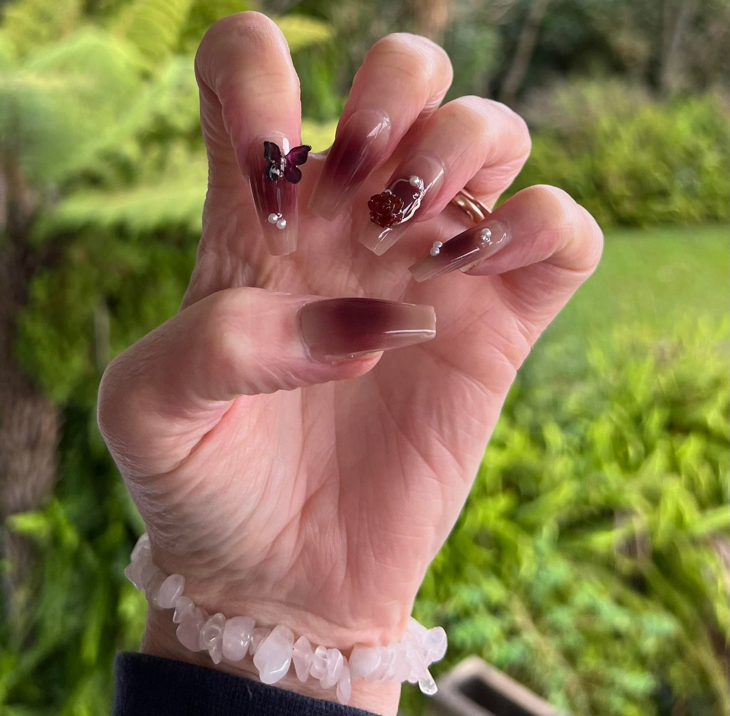 Long Coffin Press on Nails. Deep Plum, Clear Tips with Jewels, Butteflies & Flowers. Easy and quick to apply. Great for those special occasions, parties or add an edge to any outfit. Gorgeous, flattering and you can re-use them again and again.